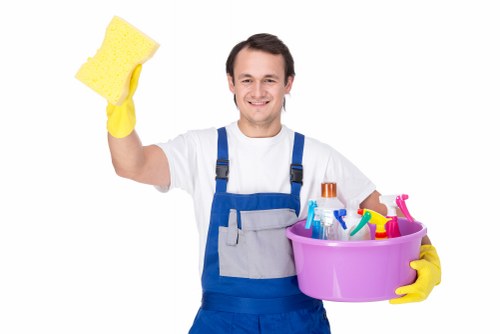 Staff member checking a carpet cleaning setup and room hazards